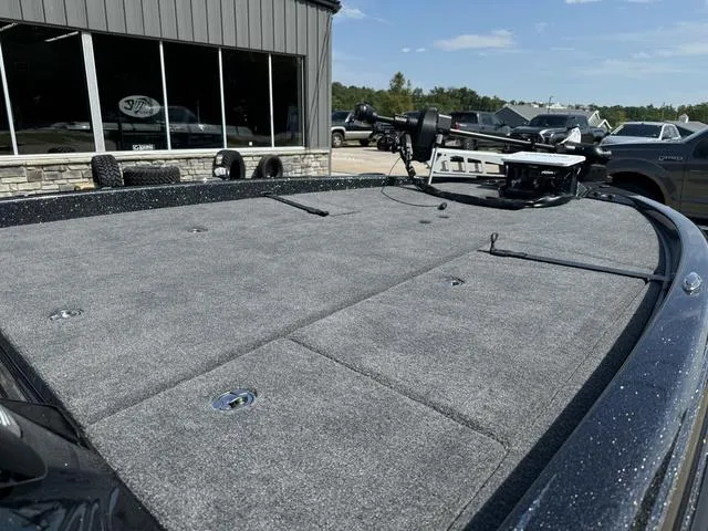 Slide: The Image of 2025 Phoenix 921 ELITE boat deck with gray carpet and trolling motor. - 8