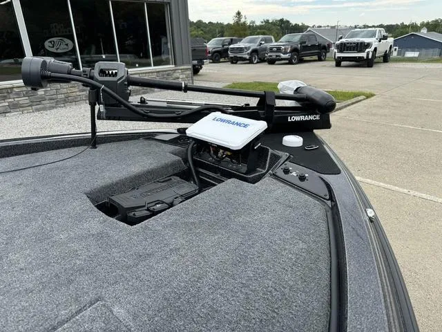 Slide: The Image of 2025 Phoenix 920 Elite boat with Lowrance equipment, parked outside dealership. - 10