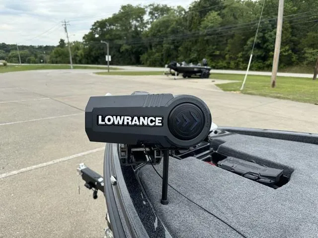 Slide: The Image of Lowrance device on 2025 Phoenix 920 Elite boat in parking lot. - 15