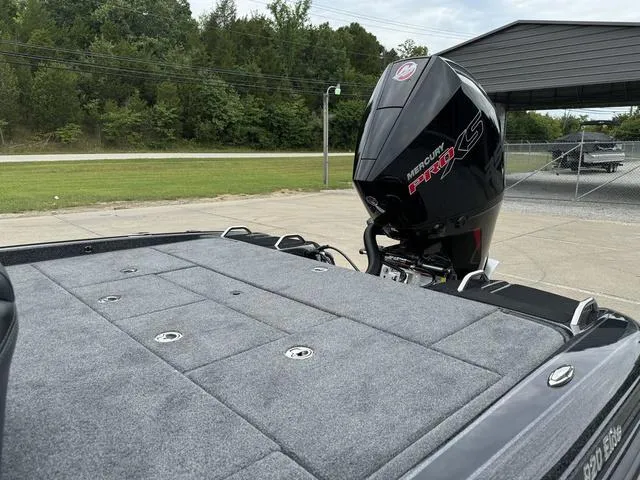 Slide: The Image of Phoenix 920 Elite 2025 boat with Mercury Pro XS engine, parked outdoors. - 19