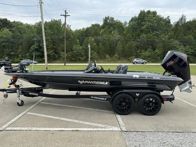 Slide: The Image of 2025 Phoenix 920 Elite boat on trailer, parked outdoors. - 21