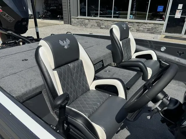 Slide: The Image of 2025 Phoenix 721 ZXL boat interior with stylish black and white seating. - 13