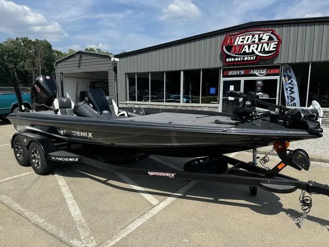 Slide: The Image of 2025 Phoenix 721 ZXL boat at Weda's Marine dealership. - 17