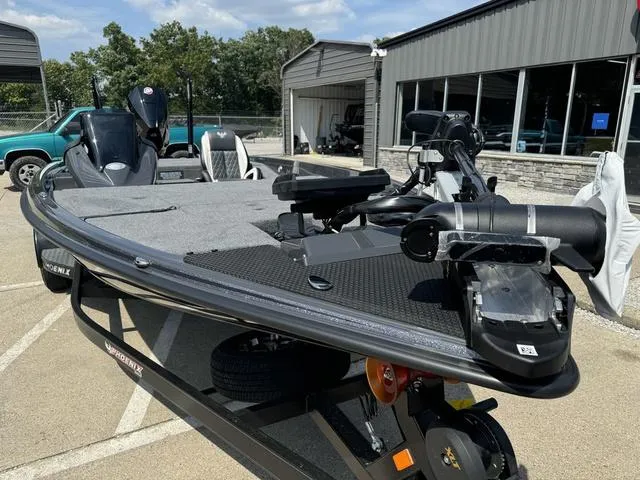 Slide: The Image of 2025 Phoenix 721 ZXL bass boat in a parking lot, featuring sleek design and modern equipment. - 18