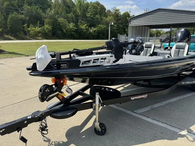 Slide: The Image of 2025 Phoenix 721 ZXL boat on trailer in outdoor setting. - 19