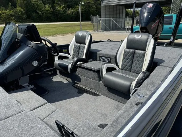 Slide: The Image of 2025 Phoenix 721 ZXL boat interior with dual seats and steering console. - 20