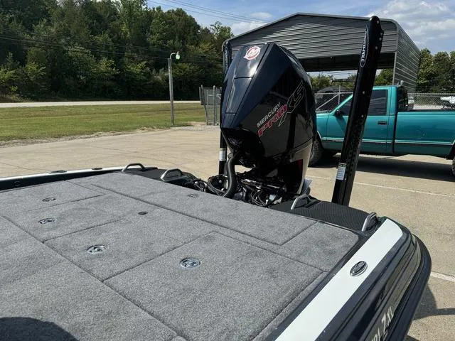 Slide: The Image of 2025 Phoenix 721 ZXL boat with Mercury Pro XS engine in a parking lot. - 23