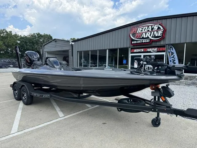 Slide: The Image of 2025 Skeeter ZXR21 boat on trailer at dealership. - 12