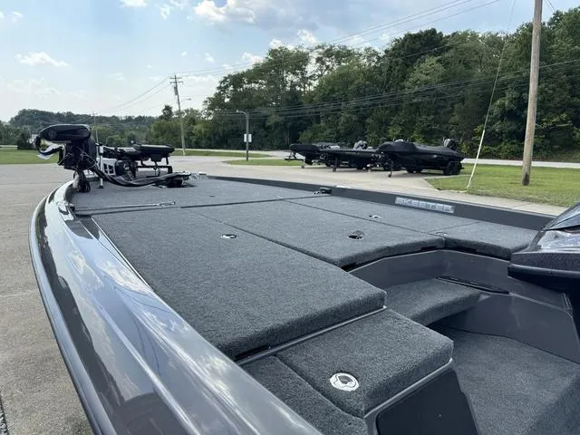 Slide: The Image of 2025 Skeeter ZXR21 boat with sleek design, parked outdoors on a sunny day. - 18