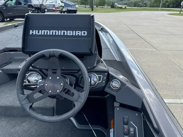 Slide: The Image of Skeeter ZXR21 2025 boat dashboard with Humminbird display and steering wheel. - 5