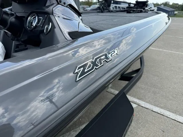 Slide: The Image of 2025 Skeeter ZXR21 boat, sleek gray design, close-up view of model logo. - 8