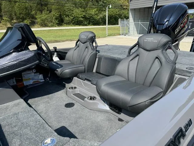 Slide: The Image of 2025 Skeeter ZXR 20 boat interior with sleek gray seats and modern design. - 13