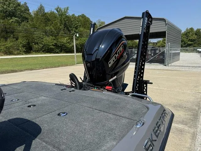 Slide: The Image of 2025 Skeeter ZXR 20 boat with powerful engine, parked outdoors. - 14
