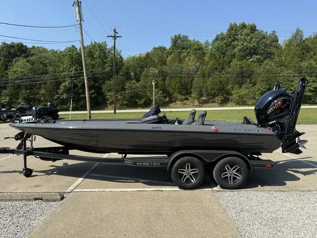 Slide: The Image of 2025 Skeeter ZXR 20 boat on trailer, parked outdoors. - 16