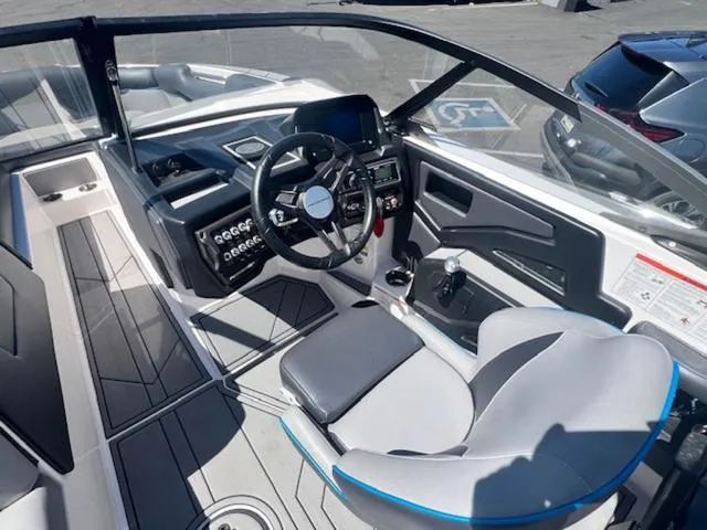 Slide: The Image of 2021 Moomba Makai boat interior with modern dashboard and steering wheel. - 11