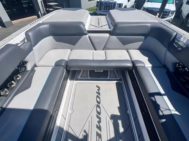 Slide: The Image of 2021 Moomba Makai boat interior with gray seating and spacious layout. - 14