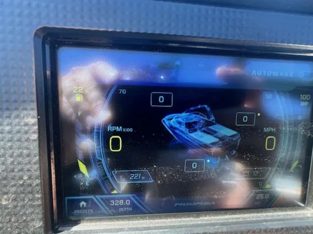 Slide: The Image of Dashboard display of a 2021 Moomba Makai boat showing RPM and speed. - 18