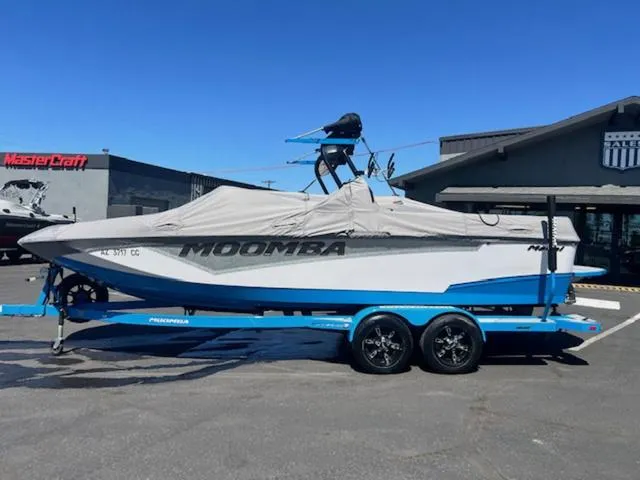 Slide: The Image of 2021 Moomba Makai boat on trailer, covered, parked outside dealership. - 19