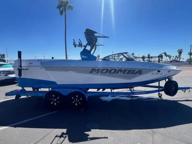 Slide: The Image of 2021 Moomba Makai boat on trailer in sunny parking lot. - 5