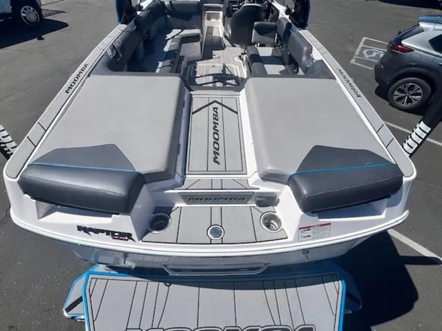 Slide: The Image of 2021 Moomba Makai boat interior with gray seating and spacious layout. - 9