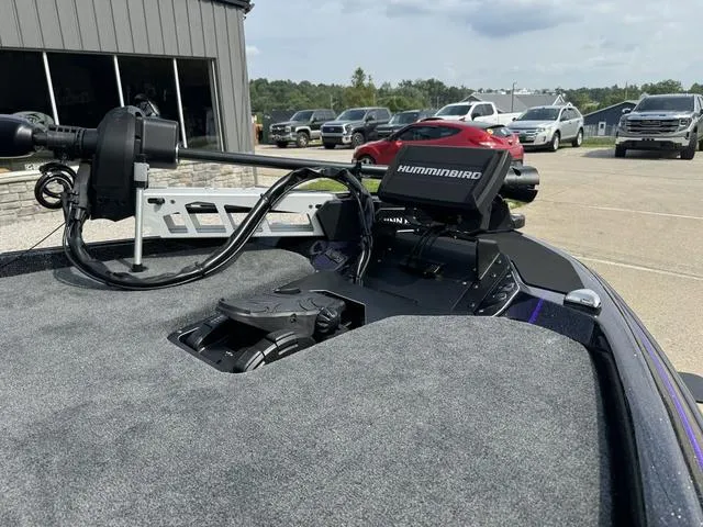 Slide: The Image of 2025 Skeeter ZXR20 boat with Humminbird electronics in a parking lot. - 10