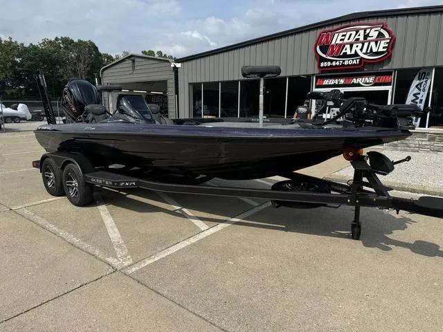 Slide: The Image of 2025 Skeeter ZXR20 boat on trailer at Weda's Marine dealership. - 12