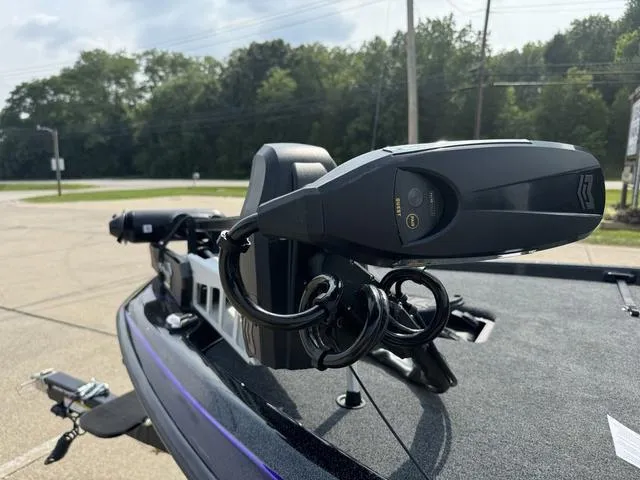 Slide: The Image of 2025 Skeeter ZXR20 boat with advanced trolling motor in a parking lot. - 14