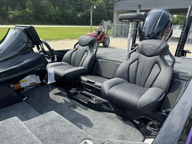 Slide: The Image of 2025 Skeeter ZXR20 boat interior with sleek black seats and modern design. - 16