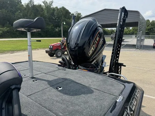 Slide: The Image of 2025 Skeeter ZXR20 boat with powerful engine, parked outdoors. - 17