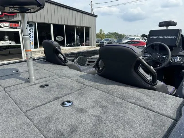 Slide: The Image of 2025 Skeeter ZXR20 boat interior with Humminbird electronics, gray seating, and spacious deck. - 6