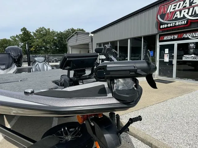 Slide: The Image of 2025 Skeeter ZXR20 boat at dealership, featuring advanced navigation equipment. - 11