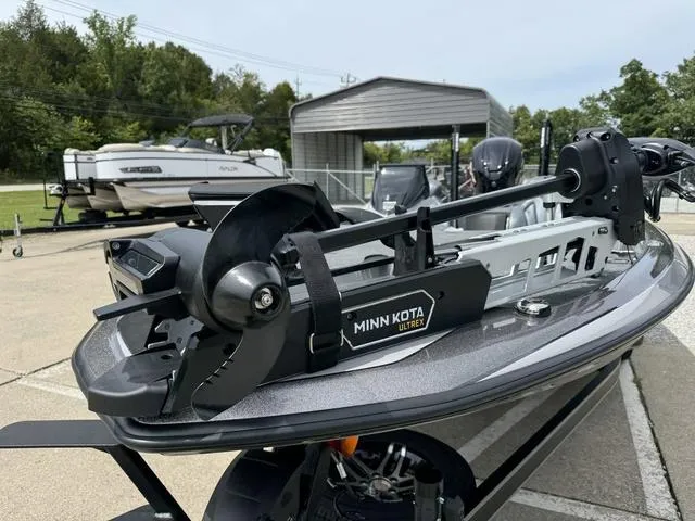 Slide: The Image of 2025 Skeeter ZXR20 boat with Minn Kota Ultrex trolling motor in a marina setting. - 12
