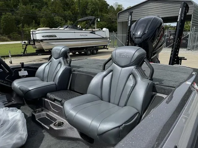 Slide: The Image of 2025 Skeeter ZXR20 boat interior with gray seats and powerful engine. - 15