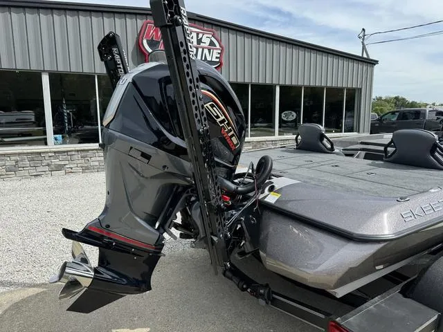 Slide: The Image of 2025 Skeeter ZXR20 boat with powerful outboard motor at dealership. - 3