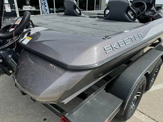 Slide: The Image of 2025 Skeeter ZXR20 boat on trailer, rear view, gray finish. - 4