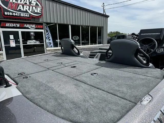 Slide: The Image of 2025 Skeeter ZXR20 boat at dealership, featuring spacious deck and modern seating. - 5