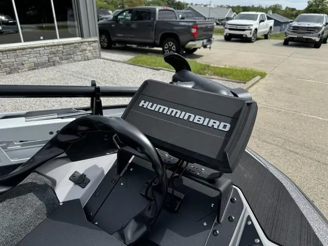 Slide: The Image of Skeeter ZXR20 boat with Humminbird fish finder, parked near trucks, 2025 model. - 9