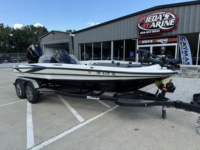 Slide: The Image of 2023 Triton 19 TrX Patriot boat on trailer at Wieda's Marine dealership. - 12