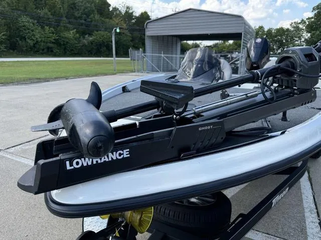 Slide: The Image of 2023 Triton 19 TrX Patriot boat with Lowrance Ghost trolling motor. - 13