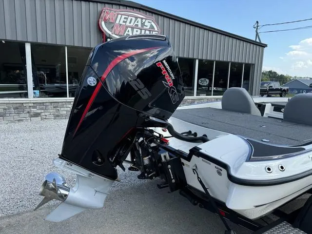 Slide: The Image of 2023 Triton 19 TrX Patriot boat with powerful outboard motor at Wieda's Marine. - 3