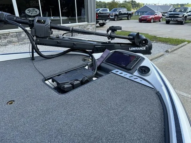 Slide: The Image of 2023 Triton 19 TrX Patriot boat with Lowrance electronics and trolling motor. - 9
