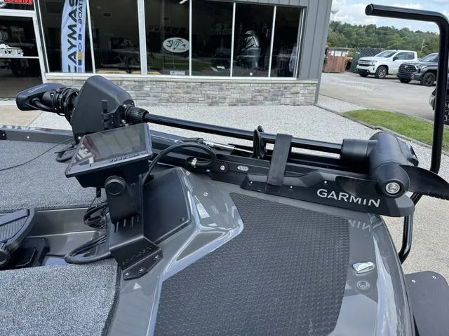 Slide: The Image of iKon VLX 21 boat with Garmin trolling motor, 2025 model, parked outside showroom. - 10