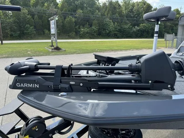 Slide: The Image of iKon VLX 21 boat with Garmin trolling motor, 2025 model, parked outdoors. - 14