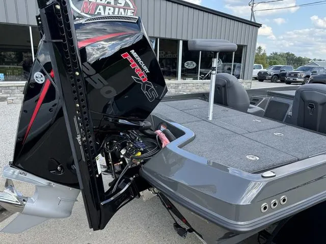 Slide: The Image of 2025 iKon VLX 21 boat with Mercury Pro XS engine, parked outside a showroom. - 3