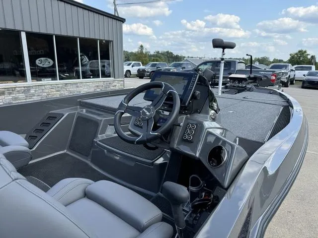 Slide: The Image of 2025 iKon VLX 21 boat interior with steering wheel and dashboard controls. - 5