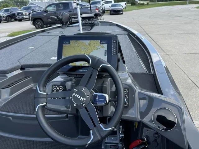 Slide: The Image of 2025 iKon VLX 21 boat dashboard with Garmin navigation system and steering wheel. - 6