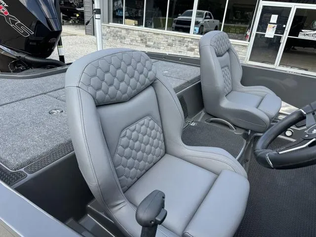 Slide: The Image of iKon VLX 21 boat interior with gray leather seats, 2025 model. - 7