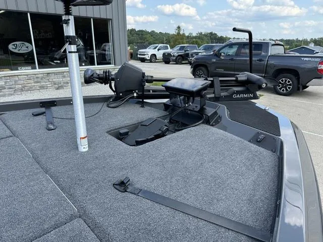 Slide: The Image of 2025 iKon VLX 21 boat deck with Garmin equipment in a parking lot. - 9