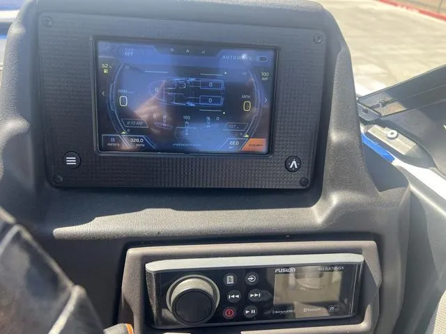Slide: The Image of 2021 Moomba Makai dashboard with touchscreen and audio controls. - 13