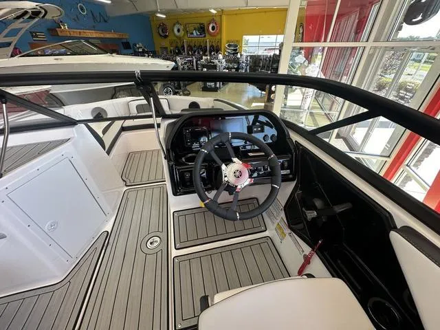 Slide: The Image of 2024 Yamaha Boats 195S interior with modern dashboard and steering wheel. - 5